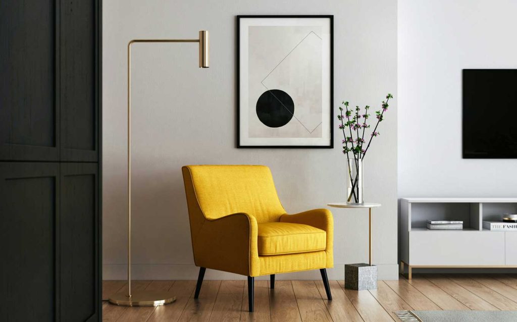 yellow chair, lamp, painting, timeless home decor trends